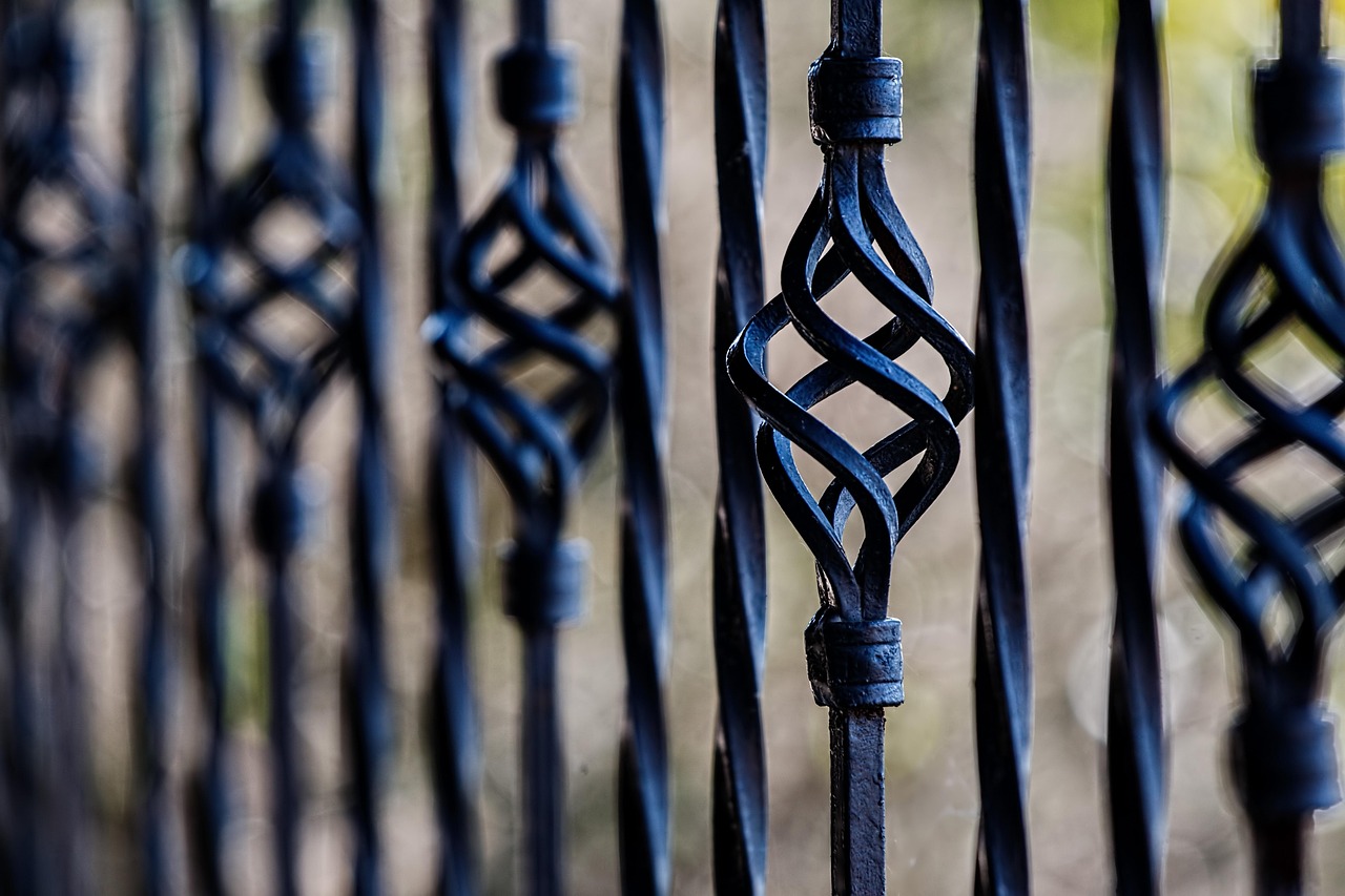 Black powder coated steel railings with an intact protective finish